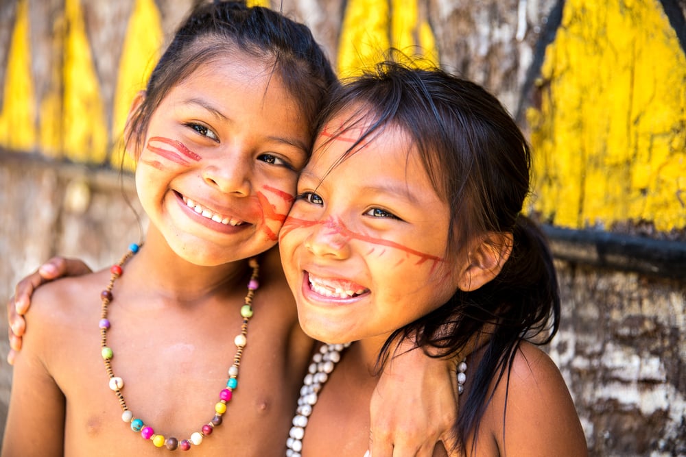 Cute Brazilian indians paying in Amazon, Brazil