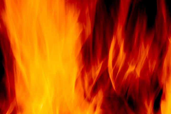 abstract blur of a fire over a black background