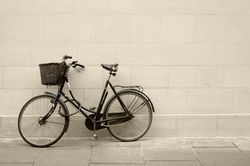 classic bycicle against a brick wall